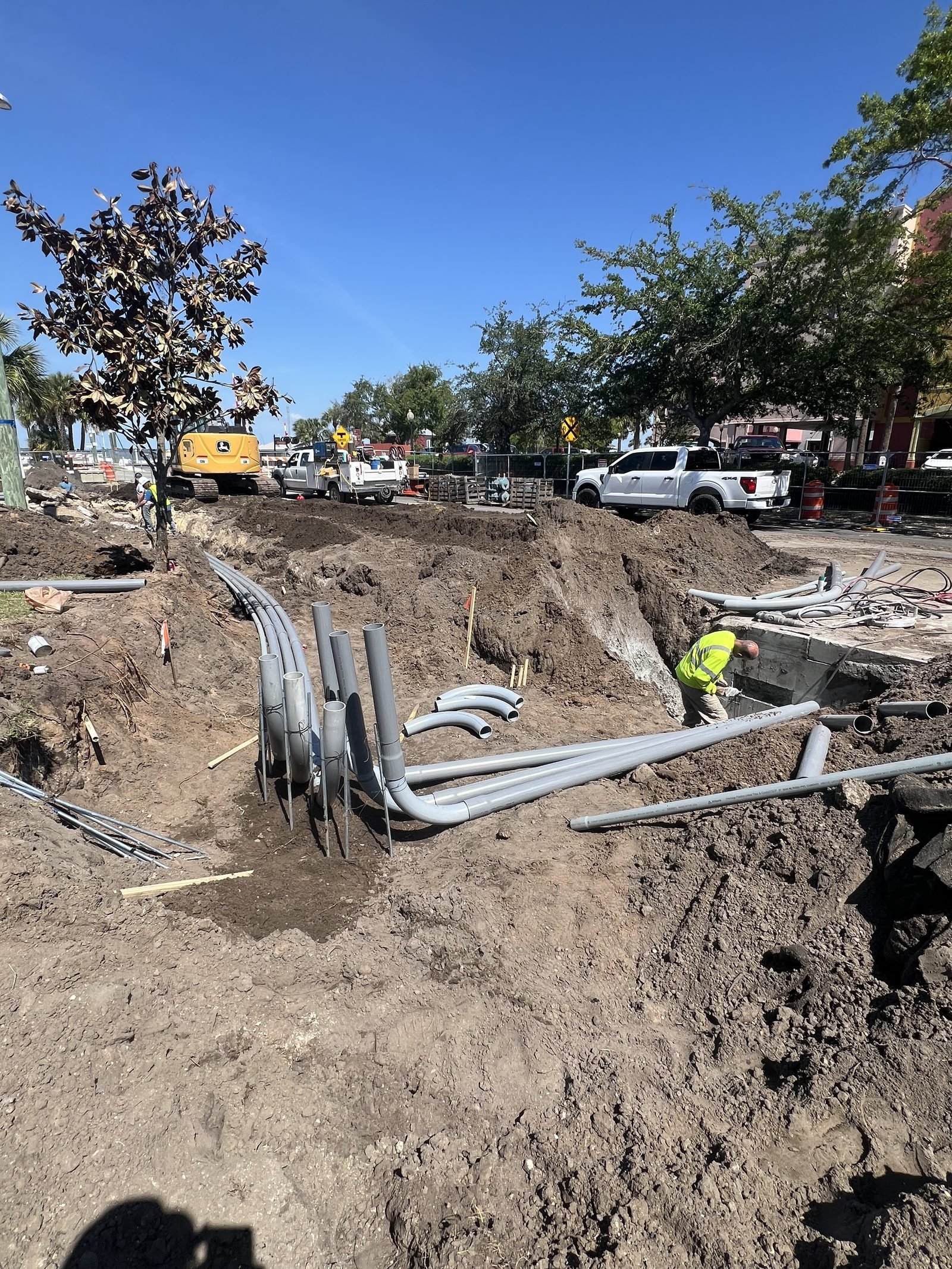 Electrician installing electrical conduit bends and risers — City of Fernandina project by Trade Pro Services