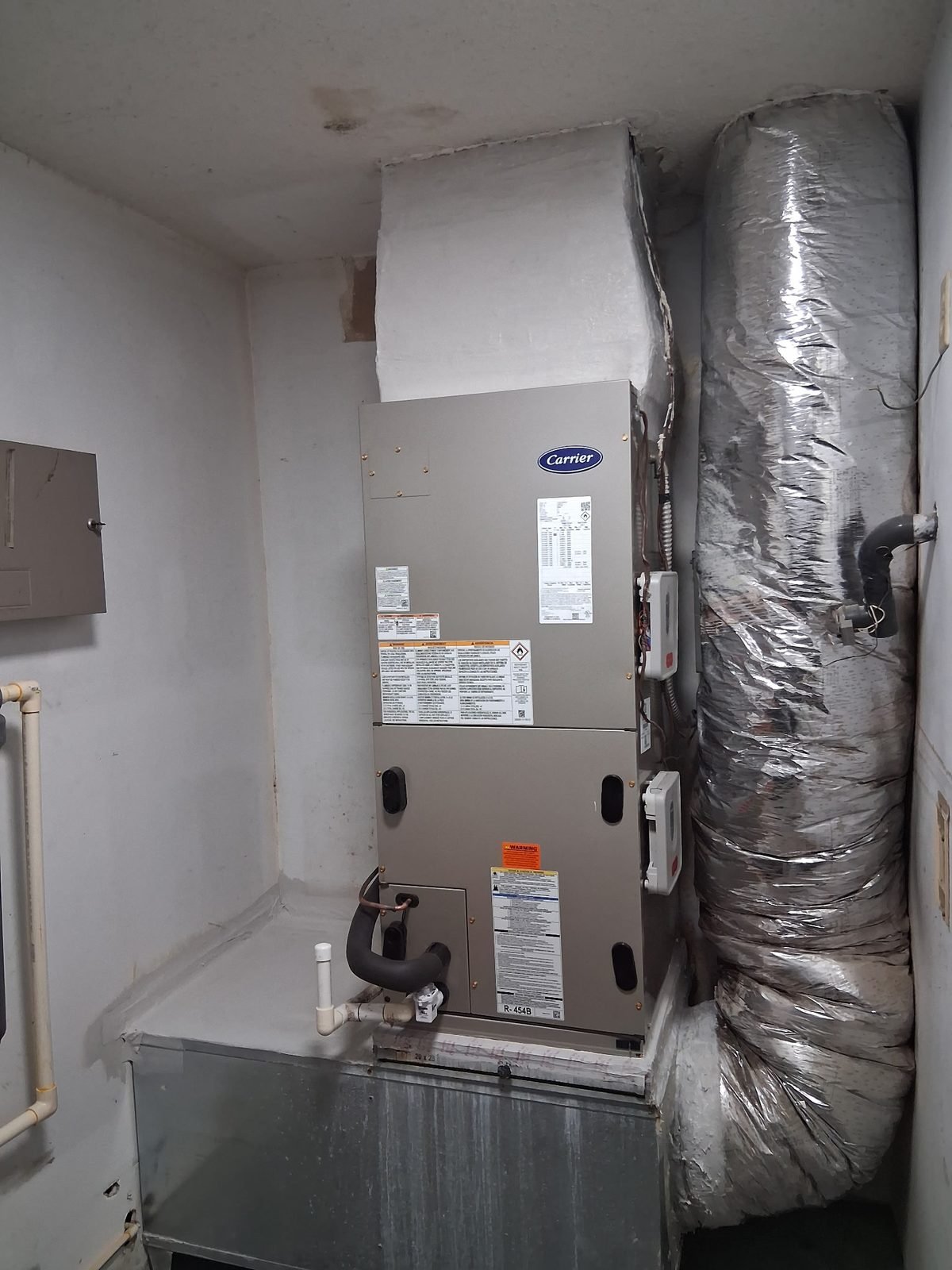 Complete mechanical closet — air handler and ductwork by Trade Pro Services